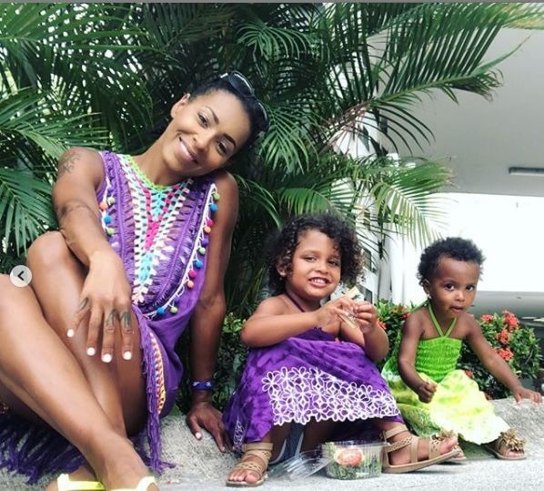 Amina Buddafly with her two daughters.